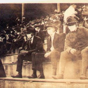 Fans wear masks at a Georgia Tech football game during the Spanish Flu, 1918. Andy McNeil. Photo credit: Thomas Carter.